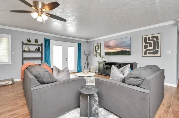 a living room with furniture and a large window