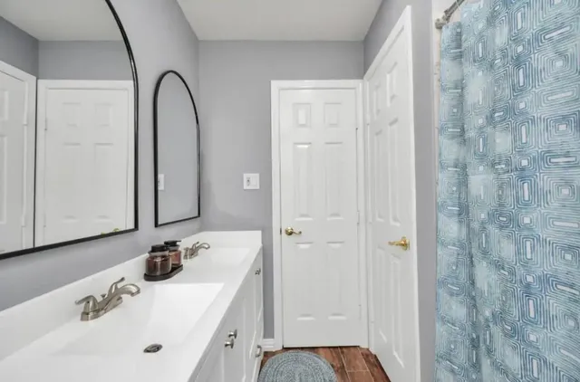 a bathroom with a sink and a mirror