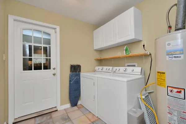 a view of storage and utility room with washer and dryer