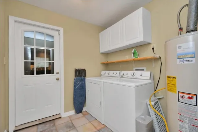 a view of storage and utility room with washer and dryer