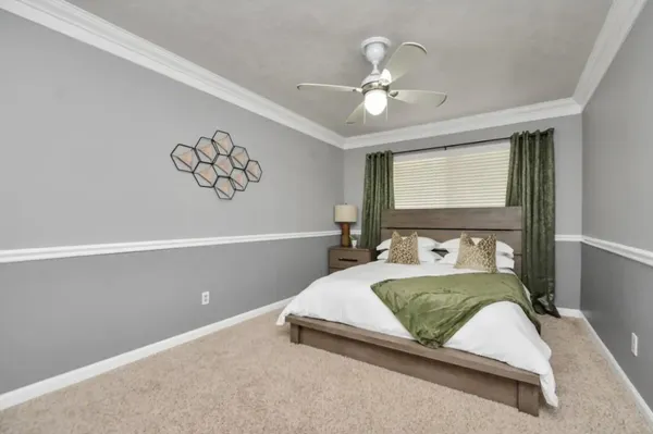 a bedroom with a bed and window