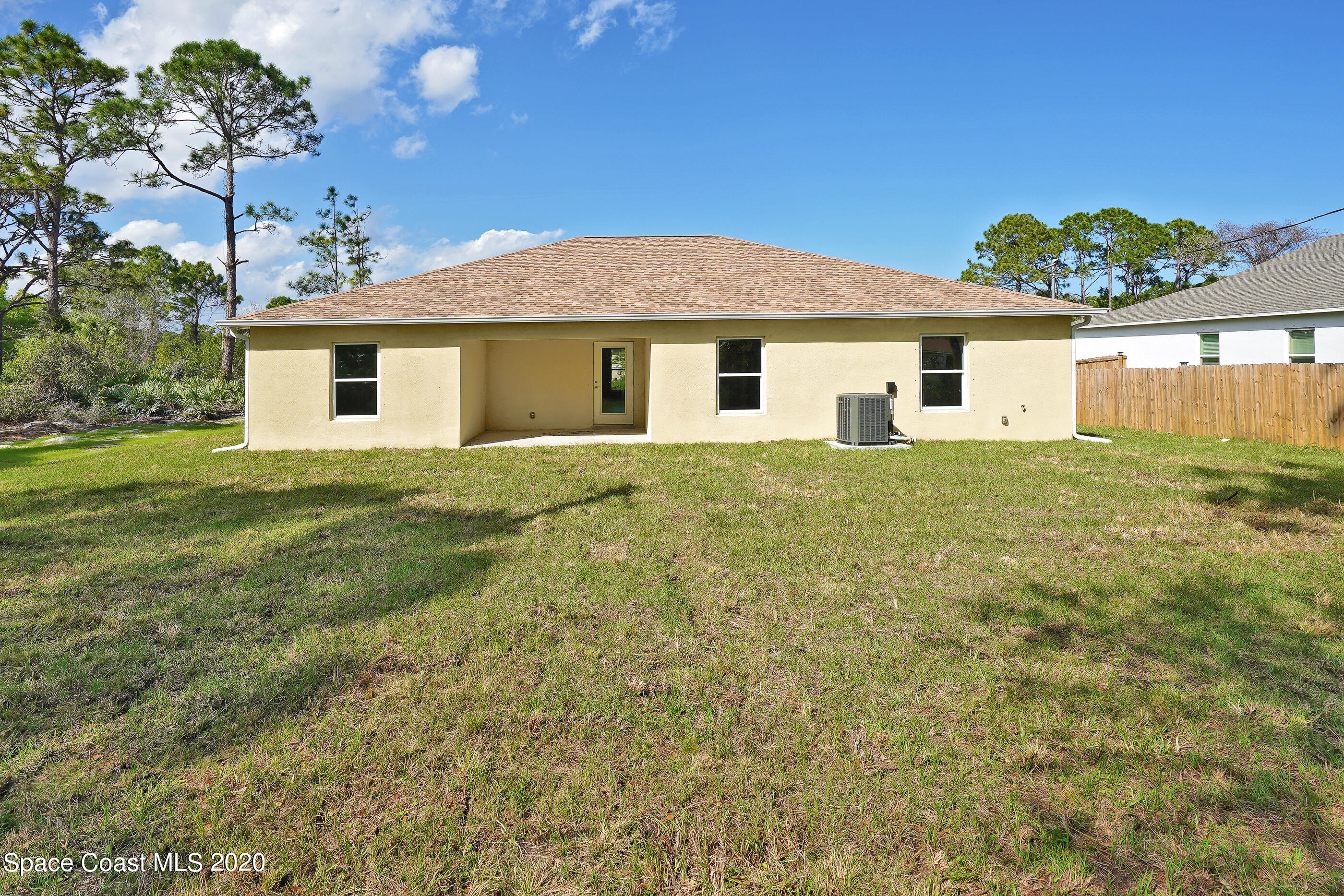 951 Cotorro Road Southeast Palm Bay, FL 32909 - Photo 29 of 29 a house with yard in front of it