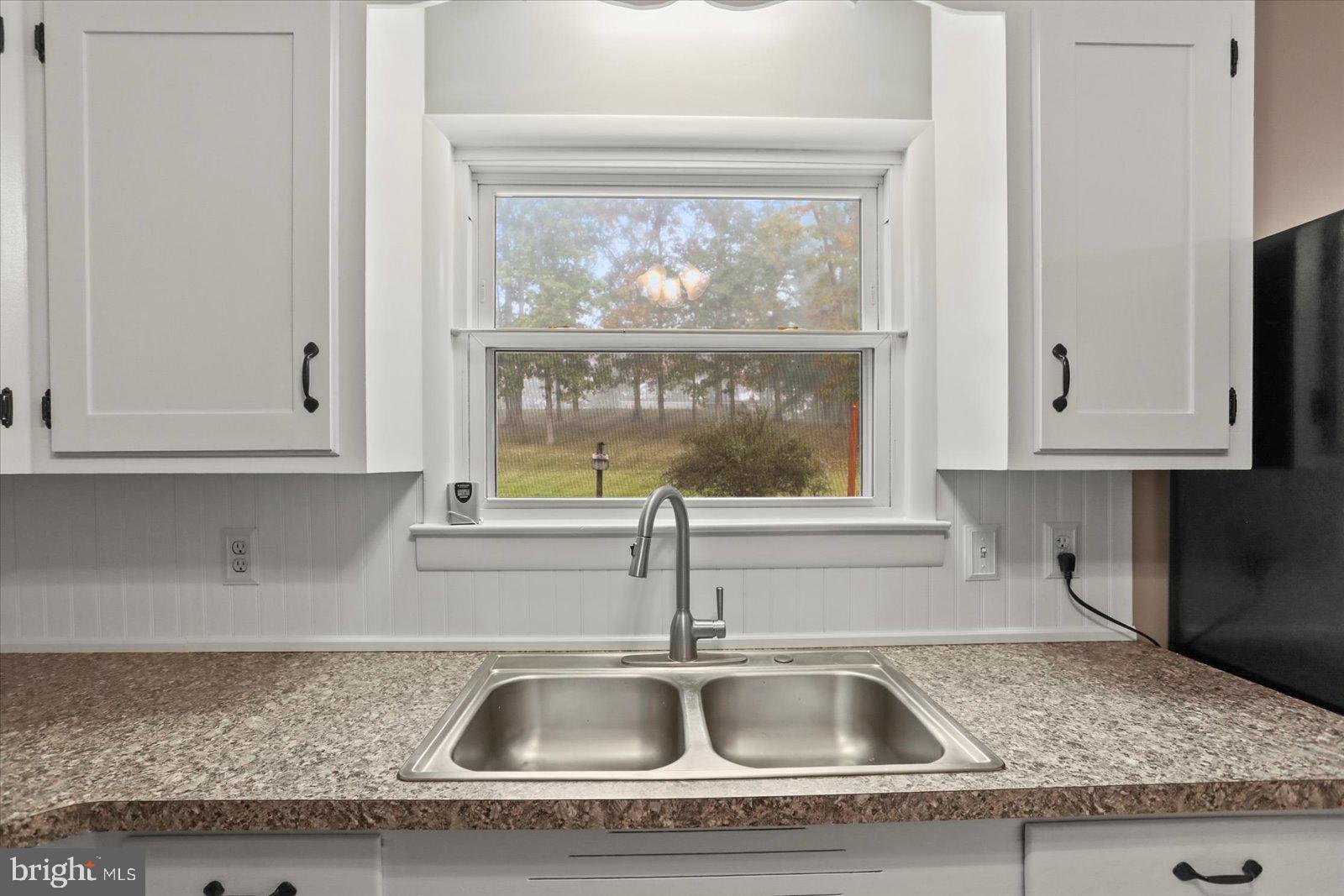 1384 Hunterstown Road Gettysburg, PA 17325 - Photo 16 of 37 a kitchen with granite countertop a sink and cabinets