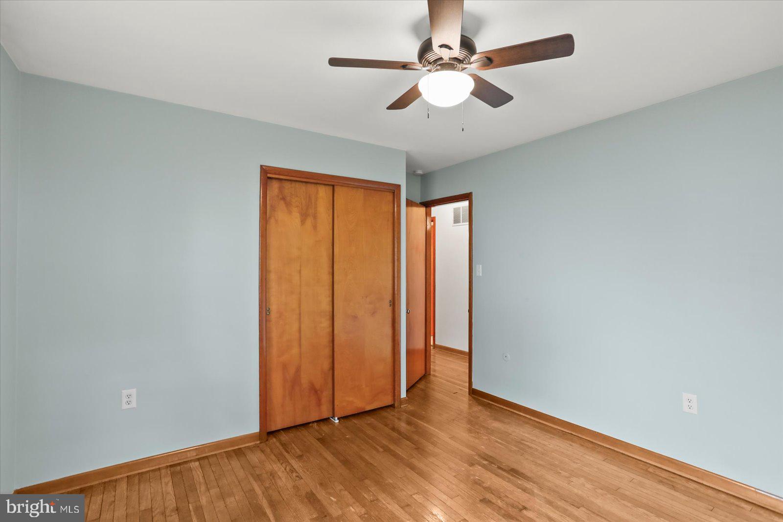 1384 Hunterstown Road Gettysburg, PA 17325 - Photo 22 of 37 an empty room with wooden floor fan and windows