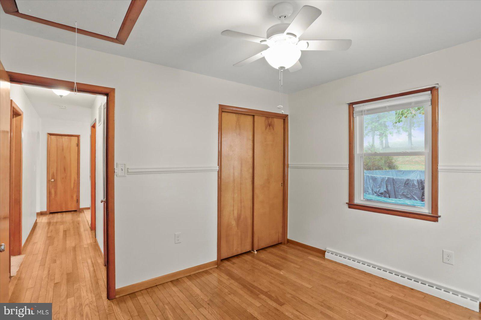 1384 Hunterstown Road Gettysburg, PA 17325 - Photo 25 of 37 a view of an empty room with wooden floor and a window
