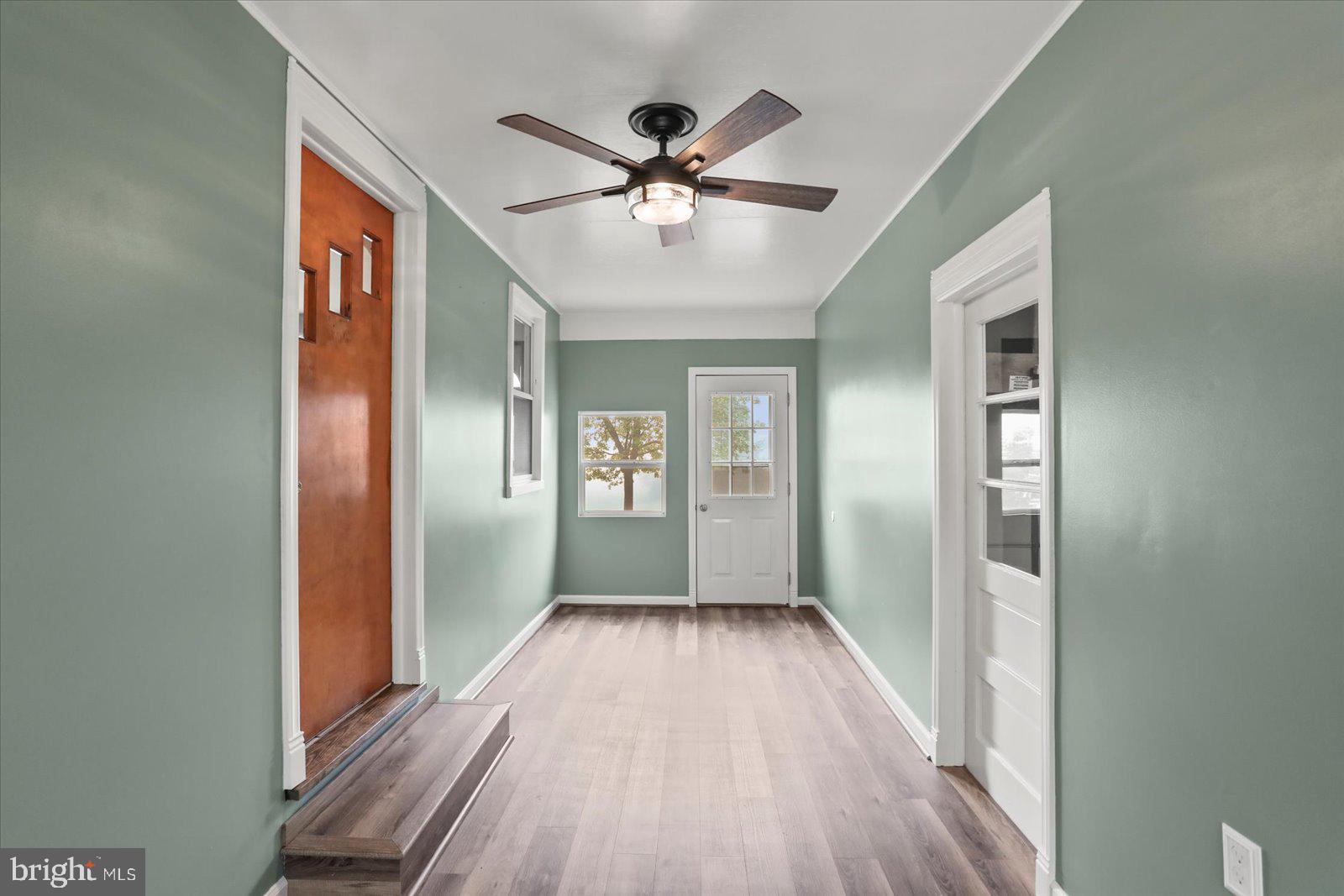 1384 Hunterstown Road Gettysburg, PA 17325 - Photo 29 of 37 a view of a hallway with wooden floor and a chandelier