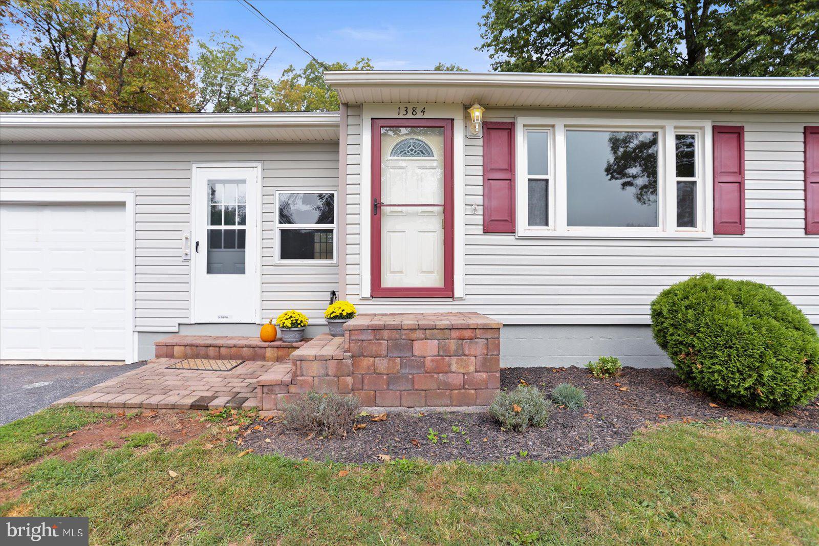 1384 Hunterstown Road Gettysburg, PA 17325 - Photo 7 of 37 a front view of a house with garden