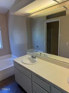 a bathroom with a sink and a bathtub