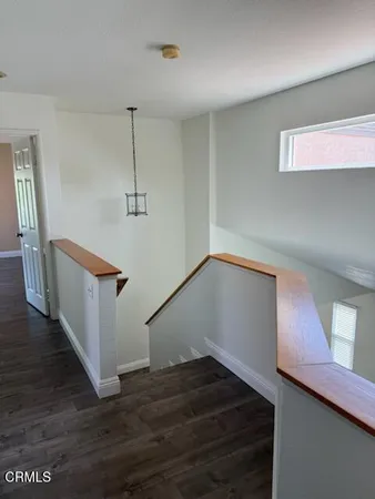 a view of a hallway with an empty room