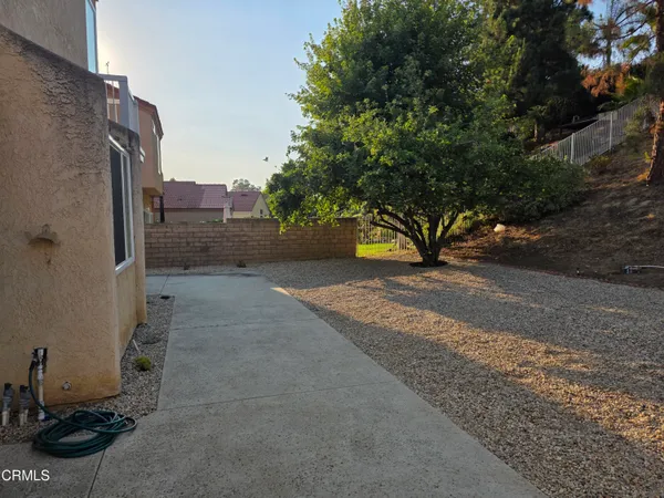 a view of a backyard of a house
