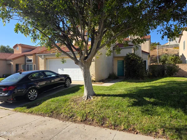 a car parked in front of a house