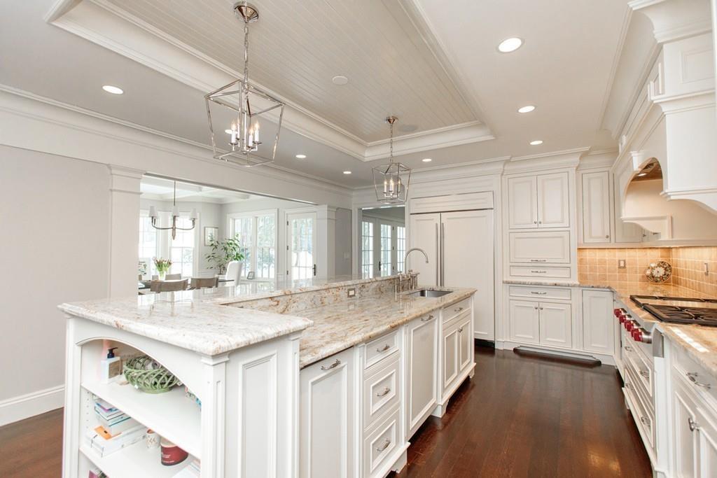 190 Winding River Road Wellesley, MA 02482 - Photo 11 of 18 a kitchen with kitchen island granite countertop lots of counter top space and stainless steel appliances