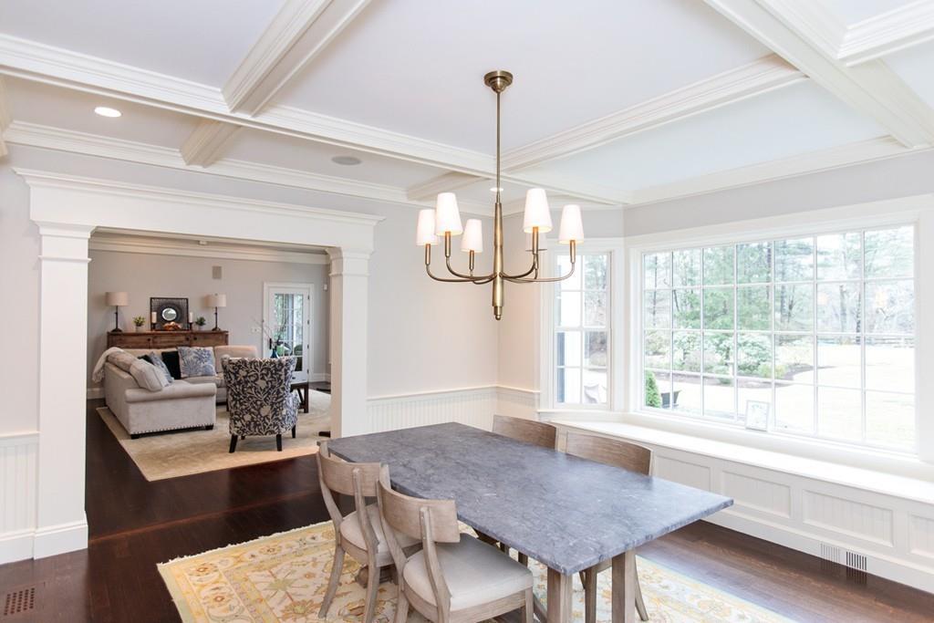 190 Winding River Road Wellesley, MA 02482 - Photo 14 of 18 a view of a dining room and livingroom with furniture wooden floor a chandelier