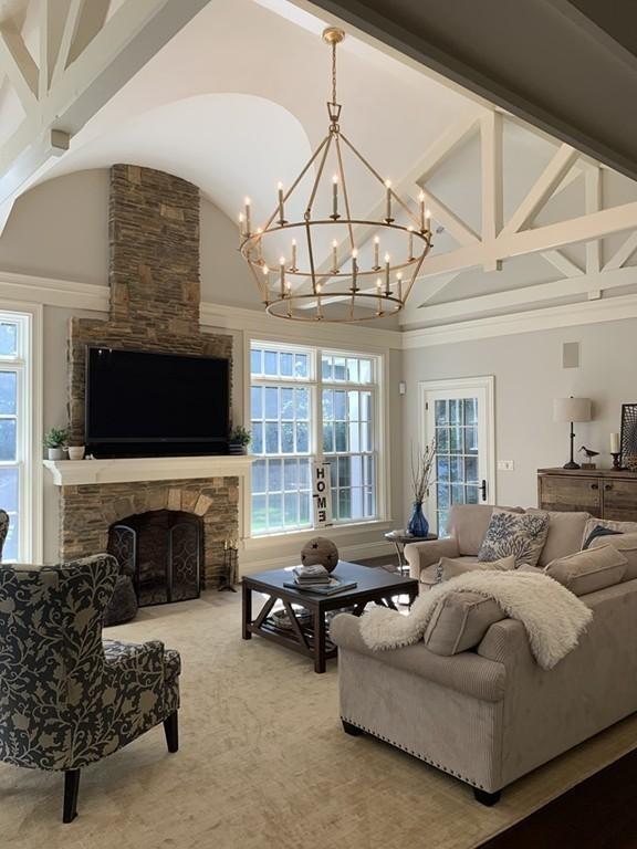 190 Winding River Road Wellesley, MA 02482 - Photo 15 of 18 a living room with furniture flat screen tv and a fireplace