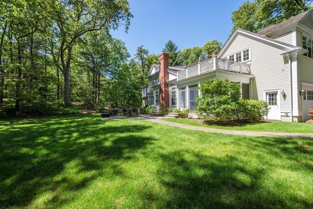 190 Winding River Road Wellesley, MA 02482 - Photo 16 of 18 a front view of house with yard and green space