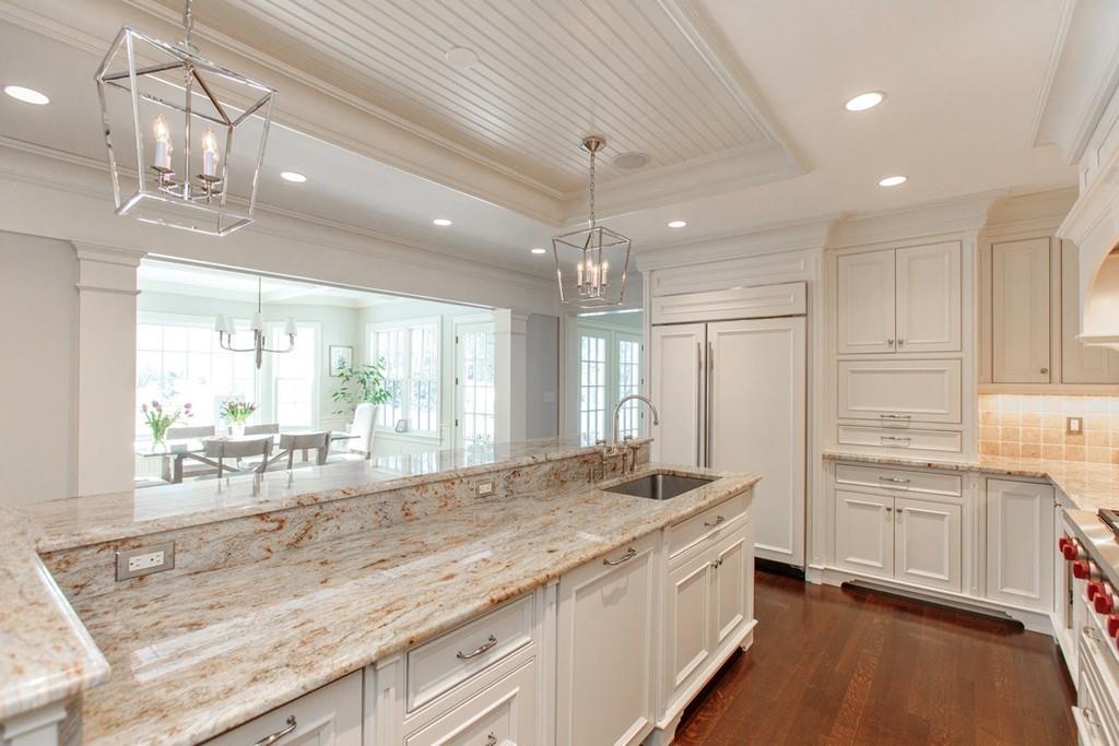 190 Winding River Road Wellesley, MA 02482 - Photo 8 of 18 a large kitchen with kitchen island granite countertop a large window and a sink