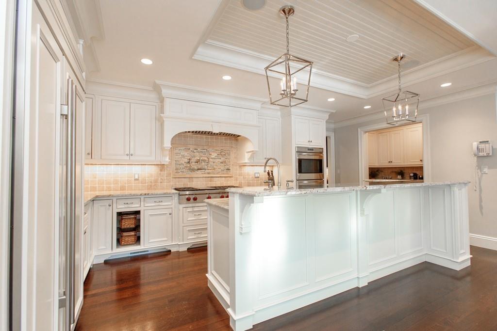 190 Winding River Road Wellesley, MA 02482 - Photo 10 of 18 a large kitchen with granite countertop a stove oven and a sink with granite countertops