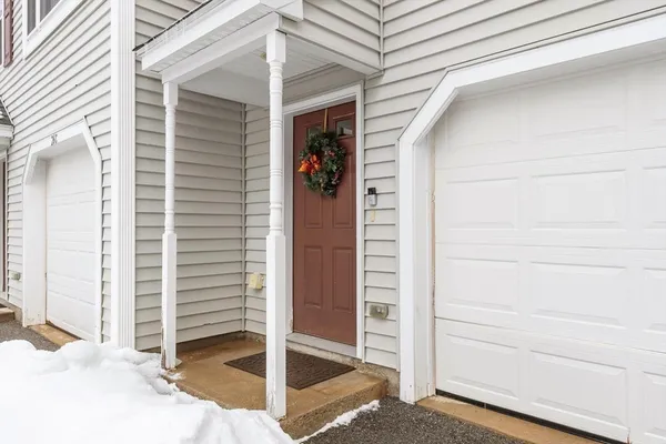 a view of front door and a window