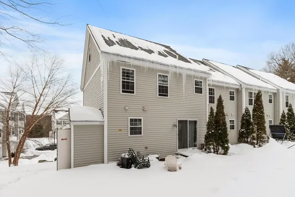 a view of a house with snow on the road