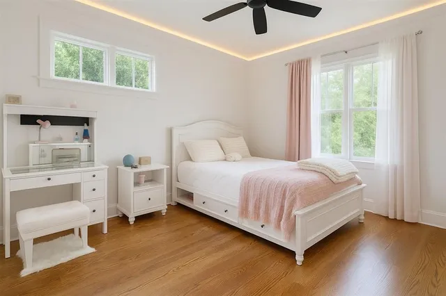 a large white bed in a white room