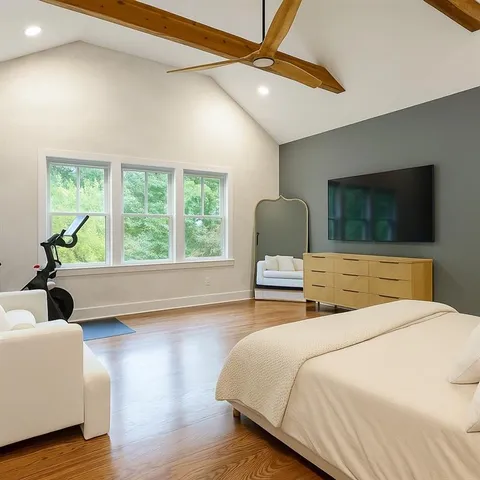 a bedroom with a bed lamps and window