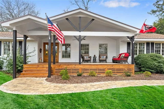 a front view of house with yard and green space