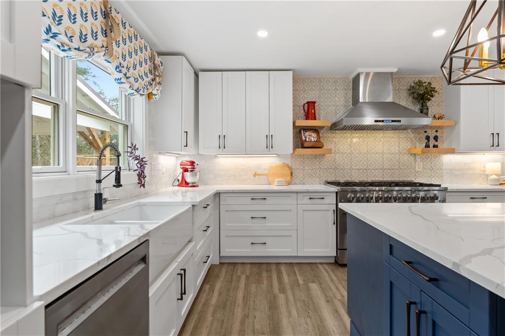 4535 South Barnett Shoals Road Athens, GA 30605 - Photo 16 of 60 a kitchen with granite countertop white cabinets and white appliances