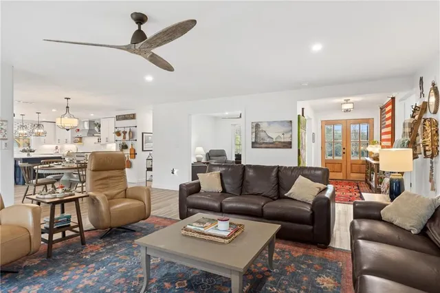 a living room with furniture and a large window