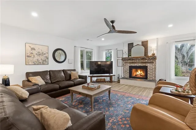 a bathroom with a granite countertop sink toilet a mirror and shower