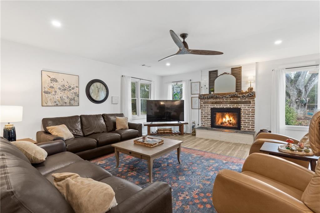 4535 South Barnett Shoals Road Athens, GA 30605 - Photo 18 of 60 a living room with furniture and a fireplace