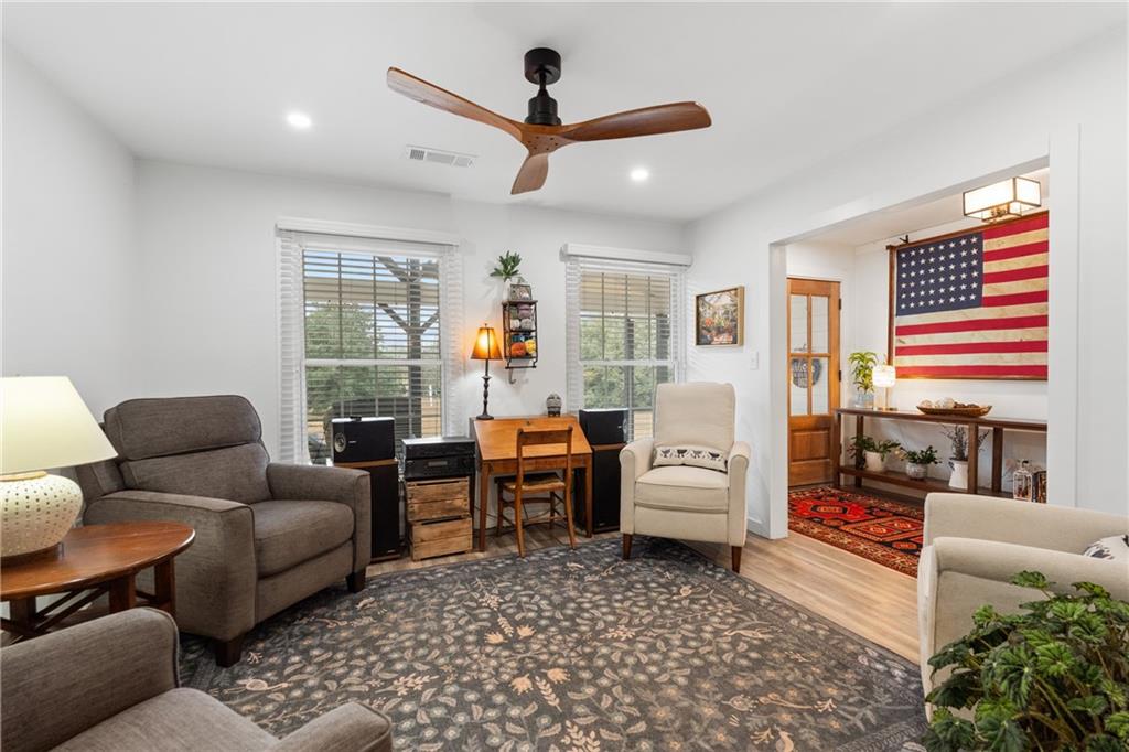 4535 South Barnett Shoals Road Athens, GA 30605 - Photo 19 of 60 a living room with furniture and a large window
