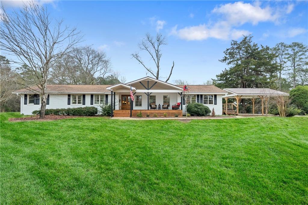 4535 South Barnett Shoals Road Athens, GA 30605 - Photo 2 of 60 a front view of house with yard and green space
