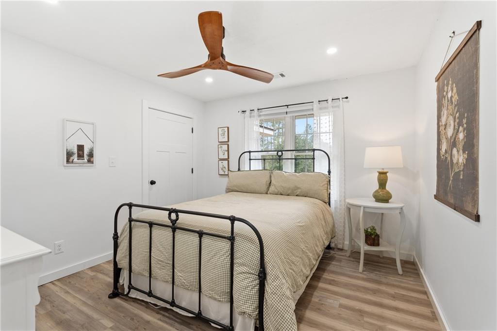 4535 South Barnett Shoals Road Athens, GA 30605 - Photo 23 of 60 a bedroom with a bed and painting on the wall