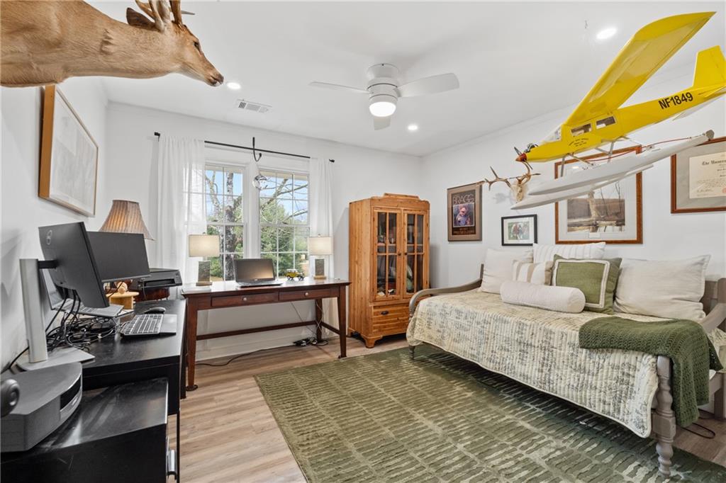 4535 South Barnett Shoals Road Athens, GA 30605 - Photo 24 of 60 a bedroom with a bed and wooden floor