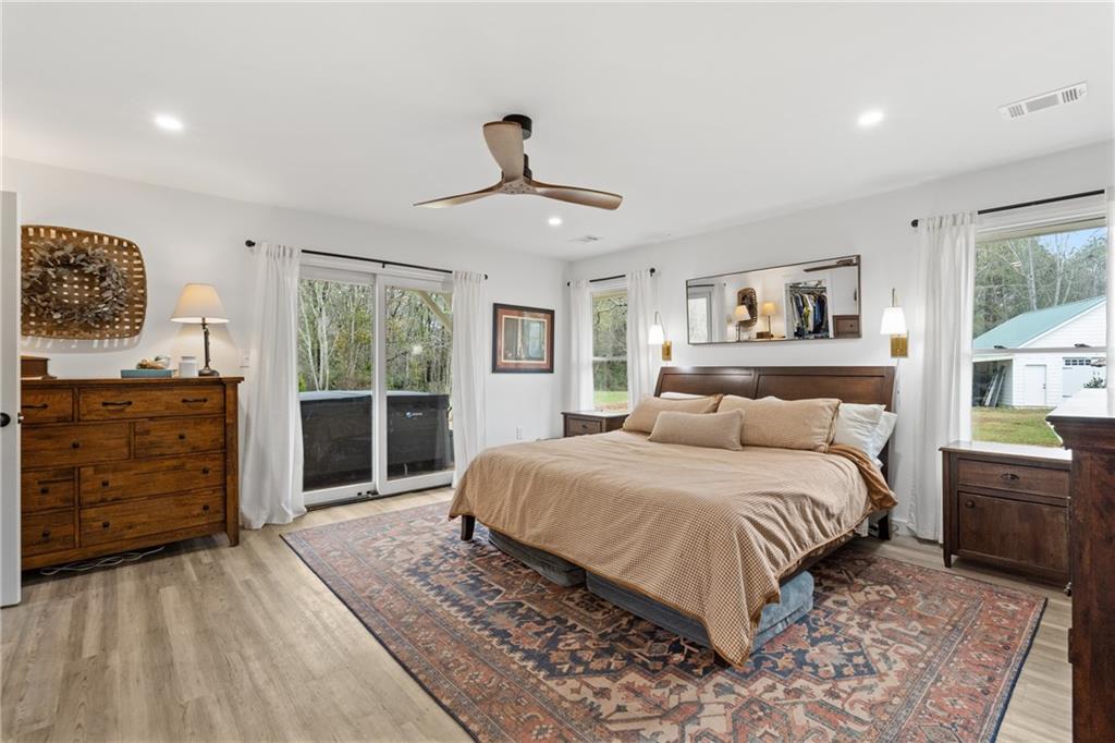 4535 South Barnett Shoals Road Athens, GA 30605 - Photo 25 of 60 a bedroom with a bed and wooden floor