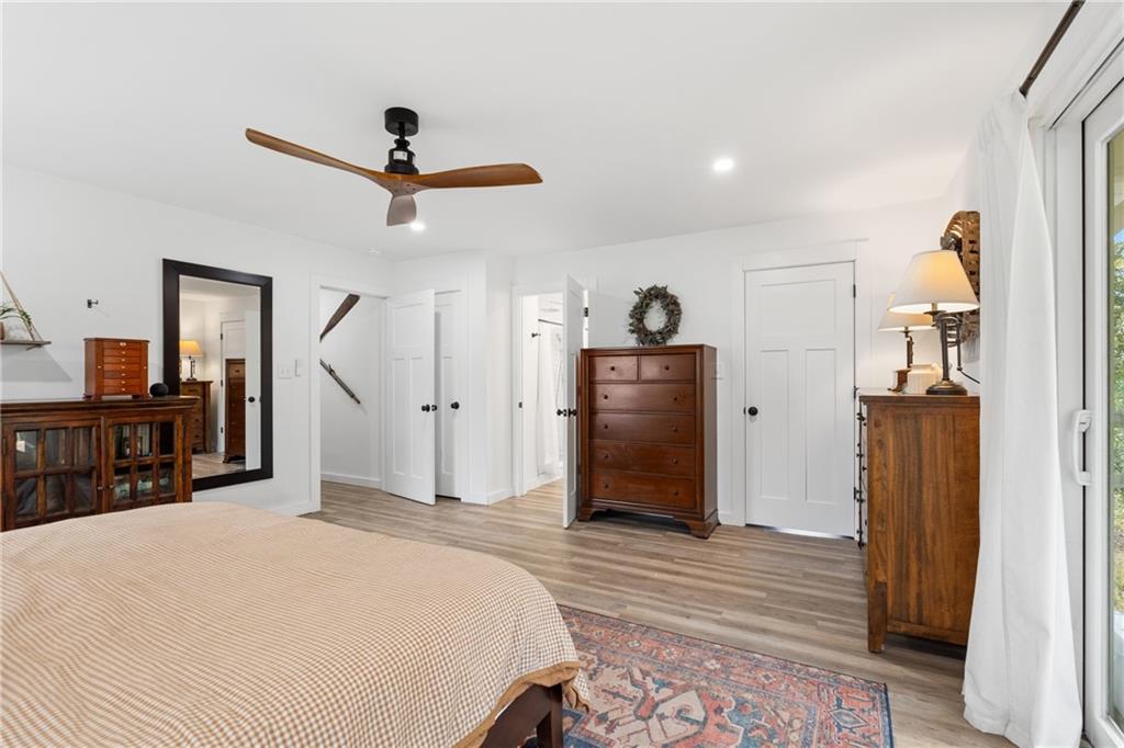 4535 South Barnett Shoals Road Athens, GA 30605 - Photo 26 of 60 a bedroom with a bed and a chandelier