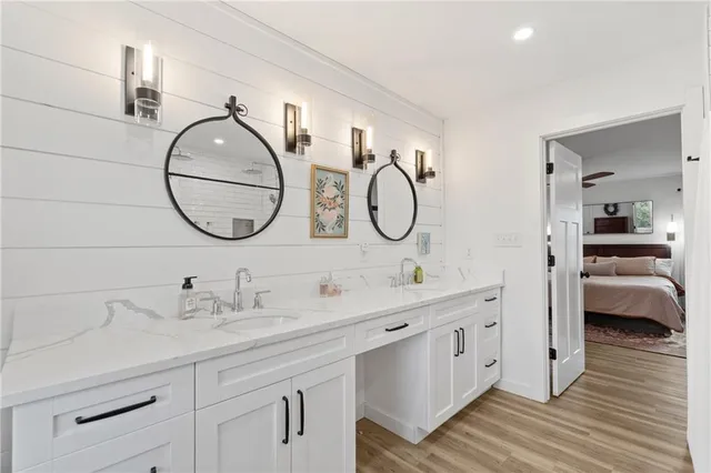 a view of a patio with table and chairs and wooden floor