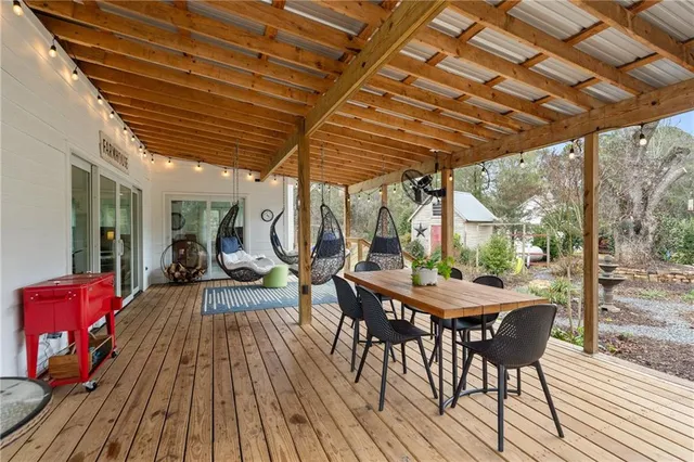 a view of swimming pool with sitting area