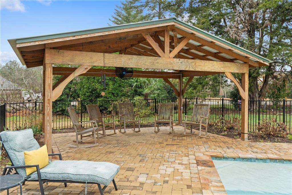 4535 South Barnett Shoals Road Athens, GA 30605 - Photo 43 of 60 a backyard of a house with table and chairs