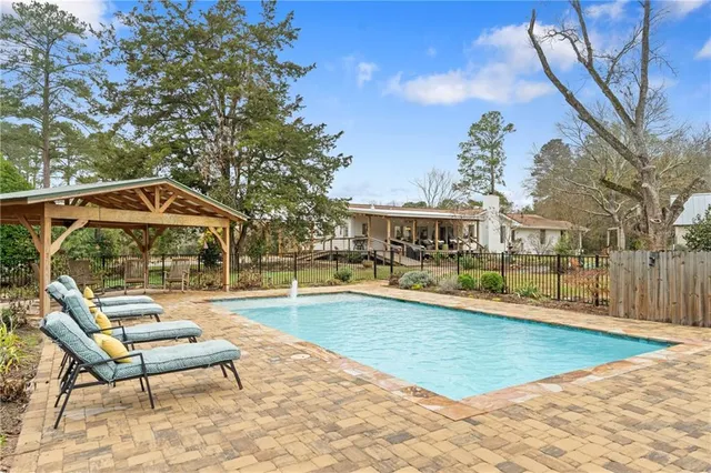 a aerial view of a residential houses with outdoor space