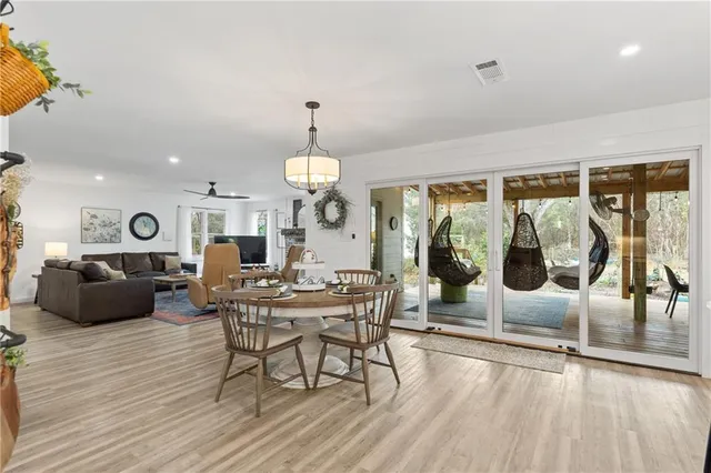 a kitchen with stainless steel appliances granite countertop a sink a stove oven a counter space and cabinets