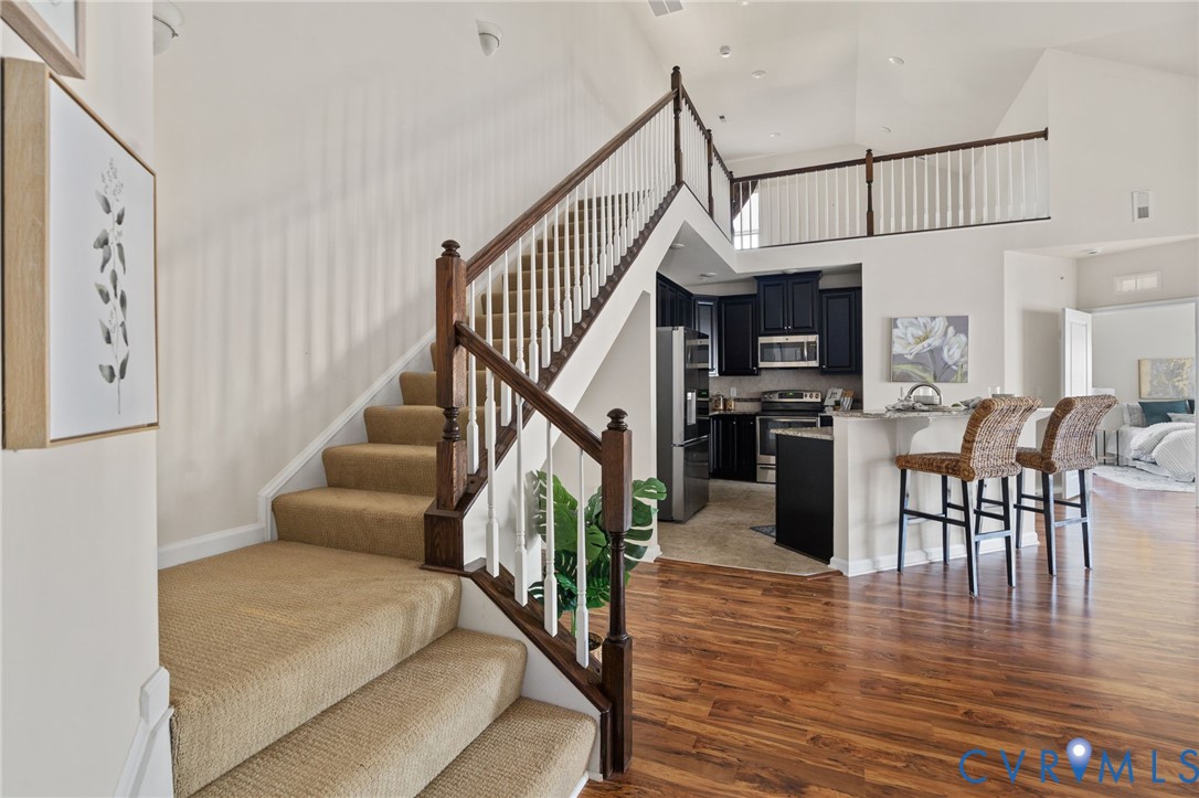 1201 Westwood Village Lane, Unit 402 Midlothian, VA 23114 - Photo 21 of 27 a view of entryway dining room and hall with wooden floor
