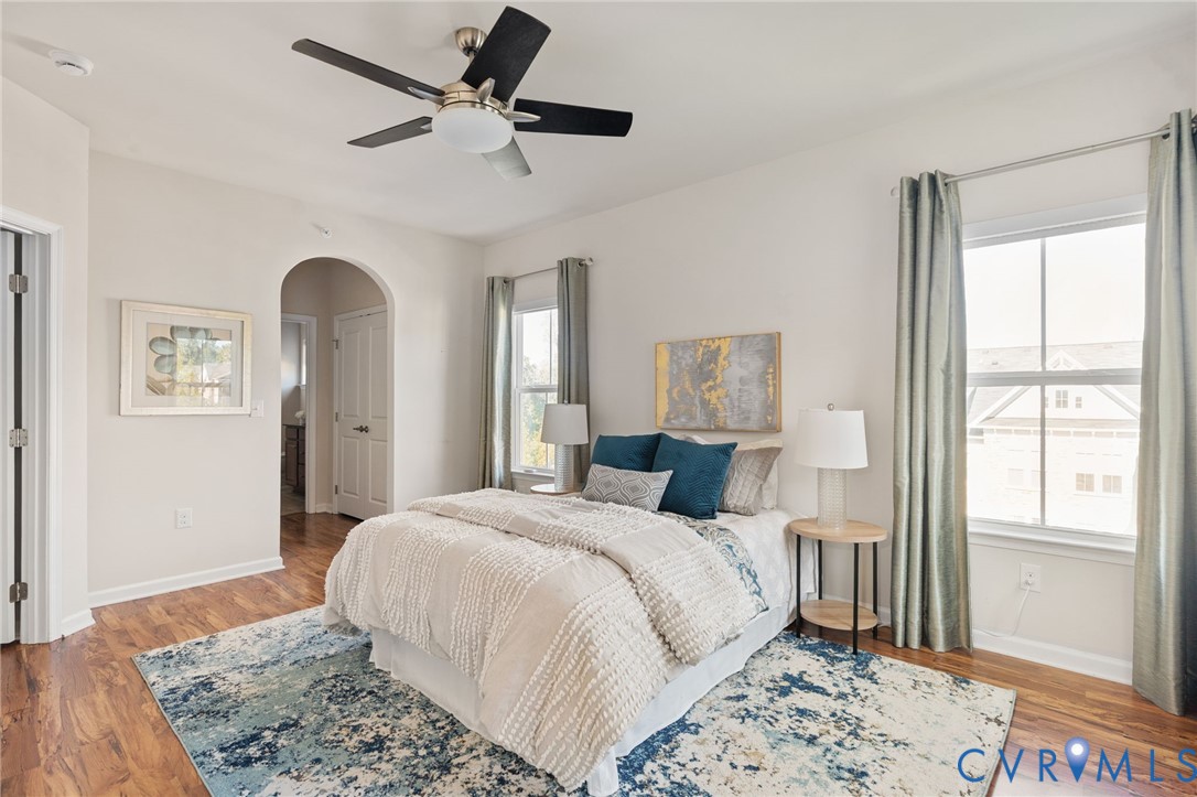 1201 Westwood Village Lane, Unit 402 Midlothian, VA 23114 - Photo 4 of 27 a bedroom with a large bed and a window