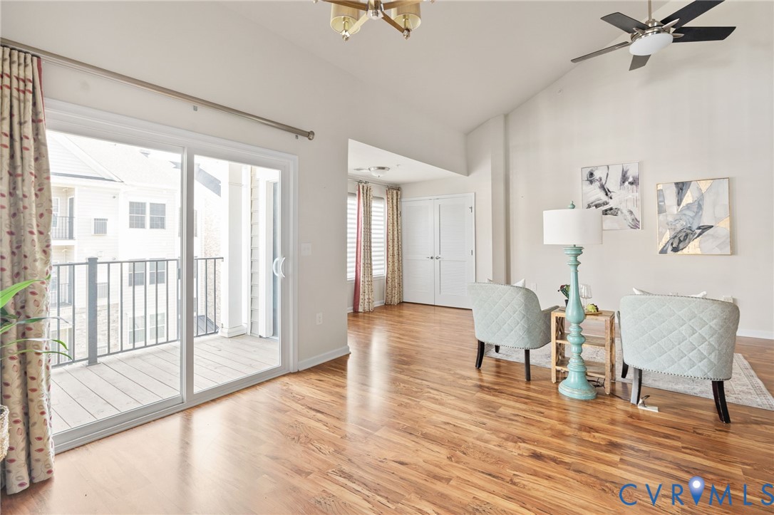 1201 Westwood Village Lane, Unit 402 Midlothian, VA 23114 - Photo 8 of 27 a living room with furniture and a wooden floor
