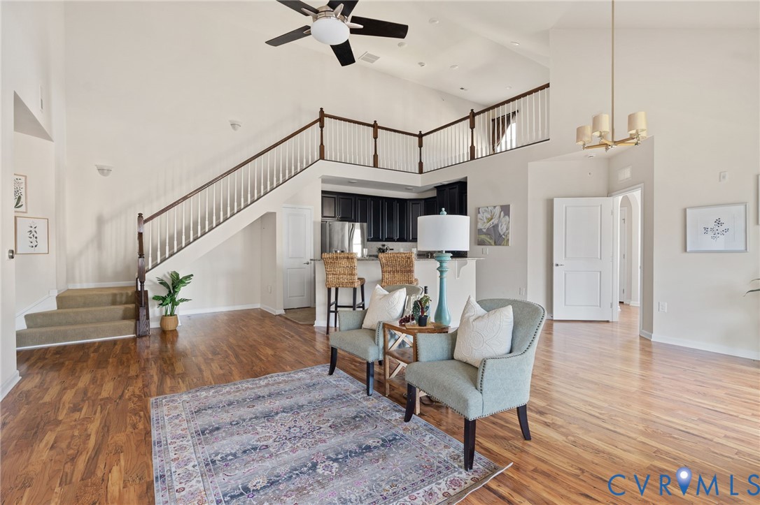 1201 Westwood Village Lane, Unit 402 Midlothian, VA 23114 - Photo 10 of 27 a living room with furniture and a wooden floor