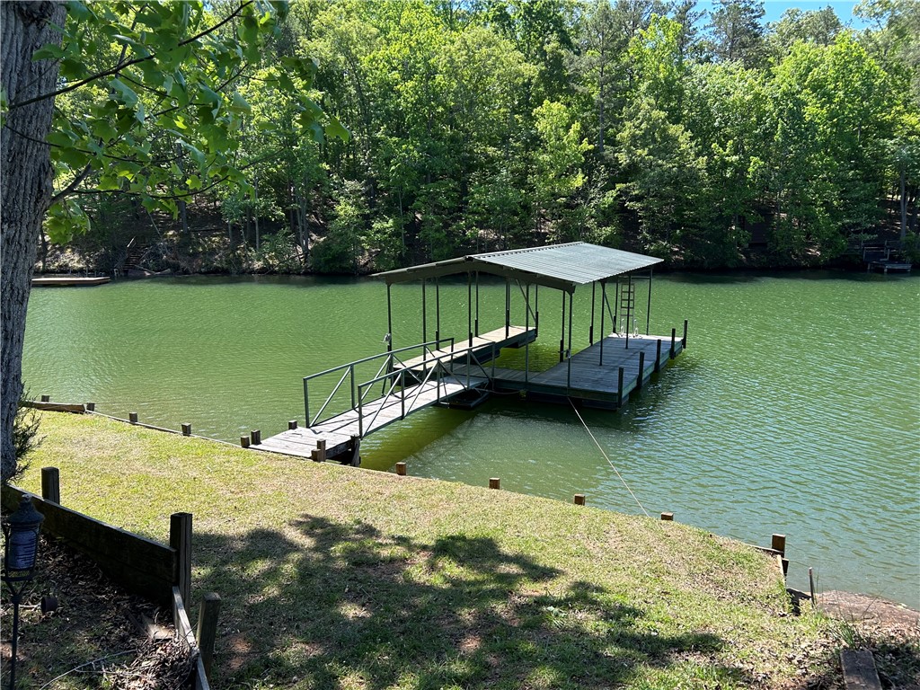 43 Sunset Cove Road Abbeville, SC 29620 - Photo 29 of 41 This serene lakefront property offers a private boat dock, perfect for water activities.