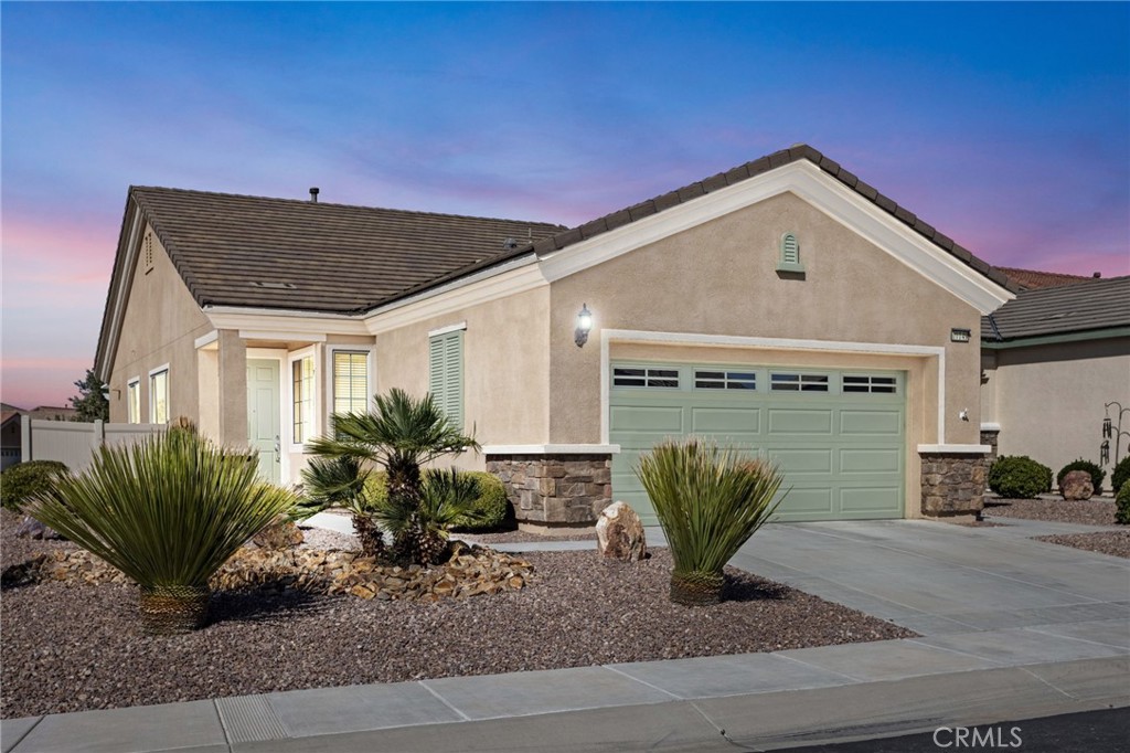 10149 Darby Road Apple Valley, CA 92308 - Photo 2 of 46 a view of a house with a potted plant and a bench