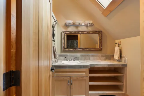 a bathroom with a sink and a mirror