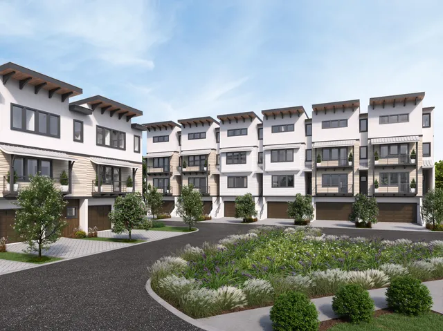 a front view of a building with a garden