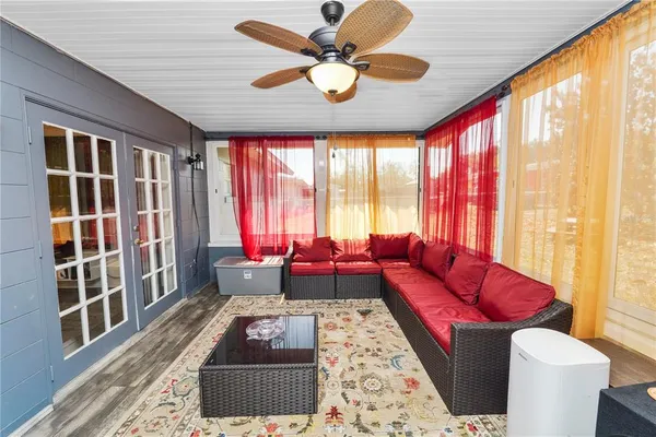 a living room with furniture and a large window